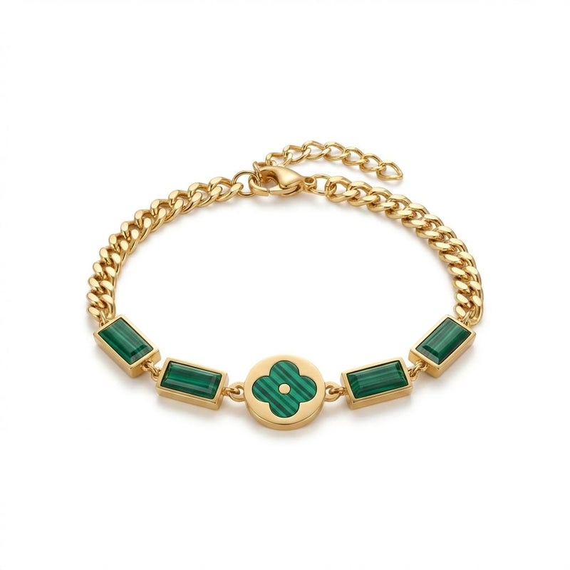 An elegant gold bracelet made of rust-resistant stainless steel, featuring a small, distinctive green flower at its center, adorned with green stones. It has an adjustable clasp for a perfect fit. - Image 1